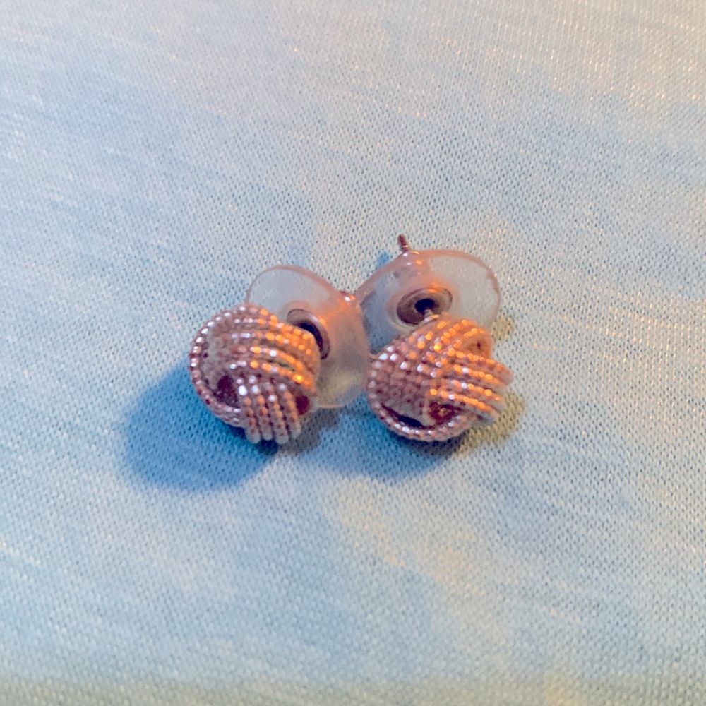 Silver tone knot earrings